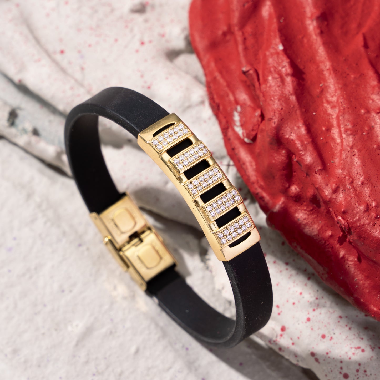 GOLD PLATED MORBIUS WITH DIAMOND IN BLACK SILICONE BRACELET