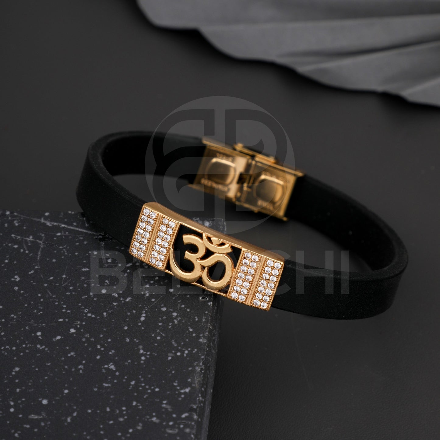 GOLD PLATED OM WITH DIAMOND IN BLACK SILICONE BRACELET